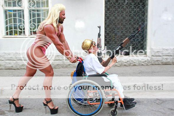 funny-wtf-wheelchair-gun-cross-dress_zpsb4e49ded.jpg