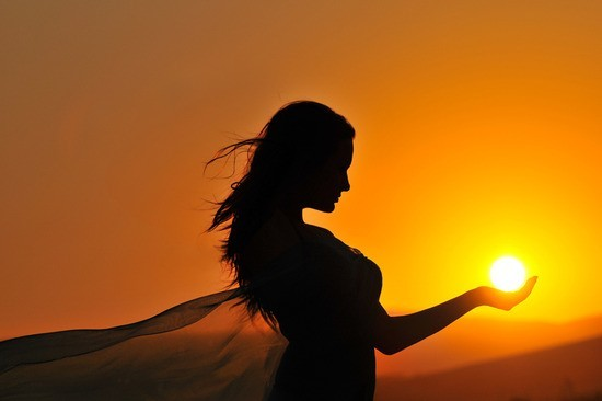 woman-sunset-sunrise-silhouette-holding-sunball1.png