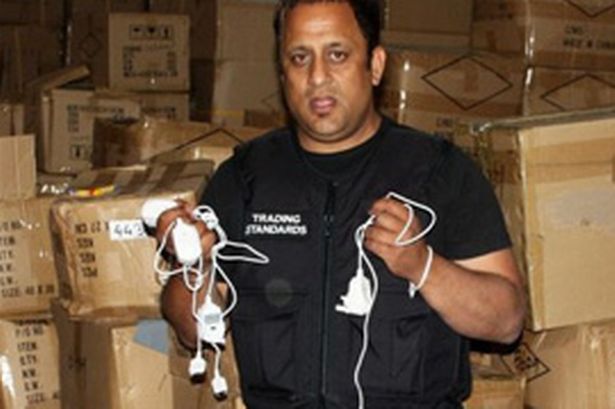trading-standards-officer-mohammed-tariq-with-seized-mobile-phone-chargers-681181555-142706.jpg